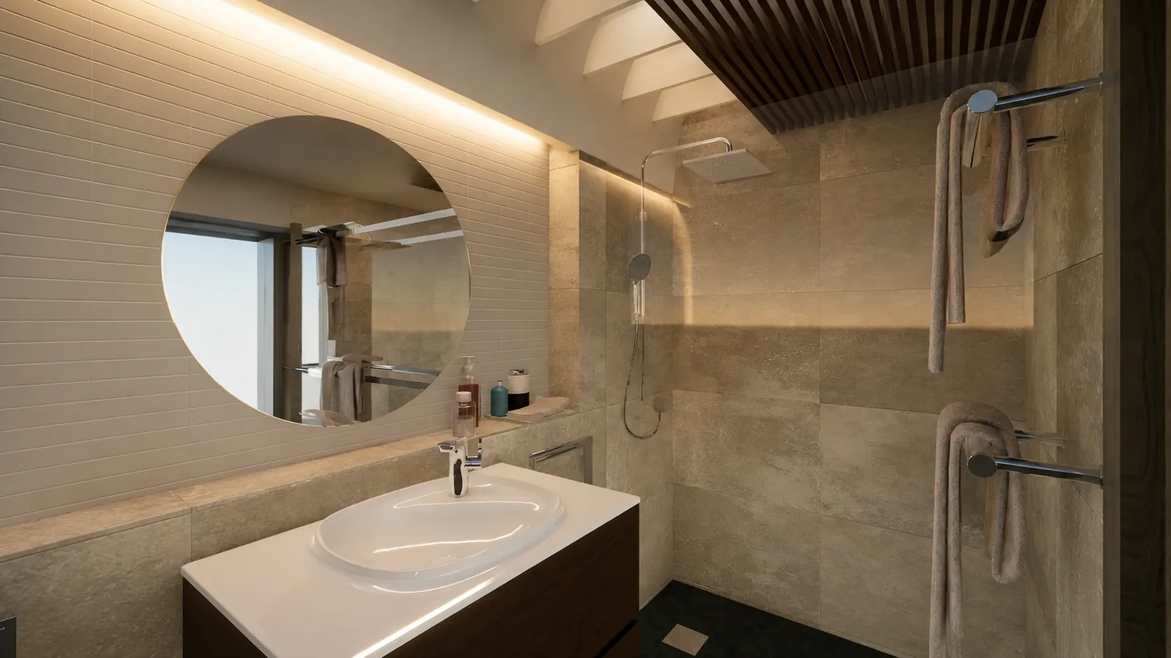 Baño reformado con espejo circular e iluminación cálida